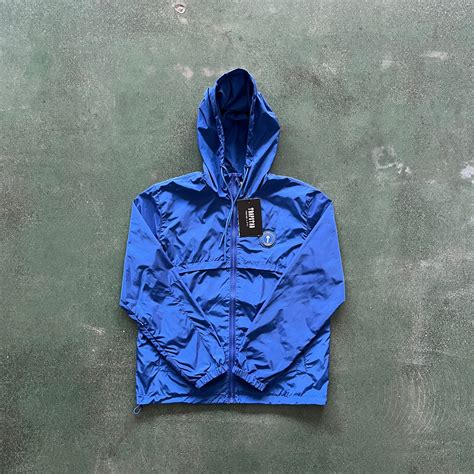 dark blue trapstar windbreaker.